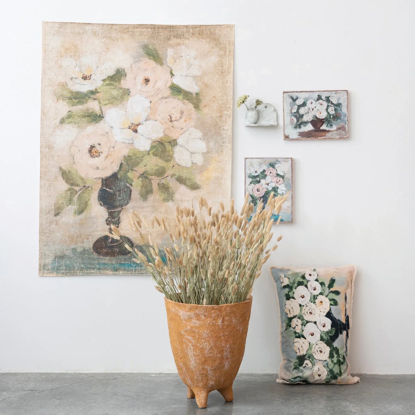 Decorator paper pictured with the two variations of canvas wall decor with flowers in vase.